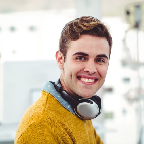 smiling-young-man-with-headphones-working-in-moder-2026-01-09-09-13-25-utc.jpg